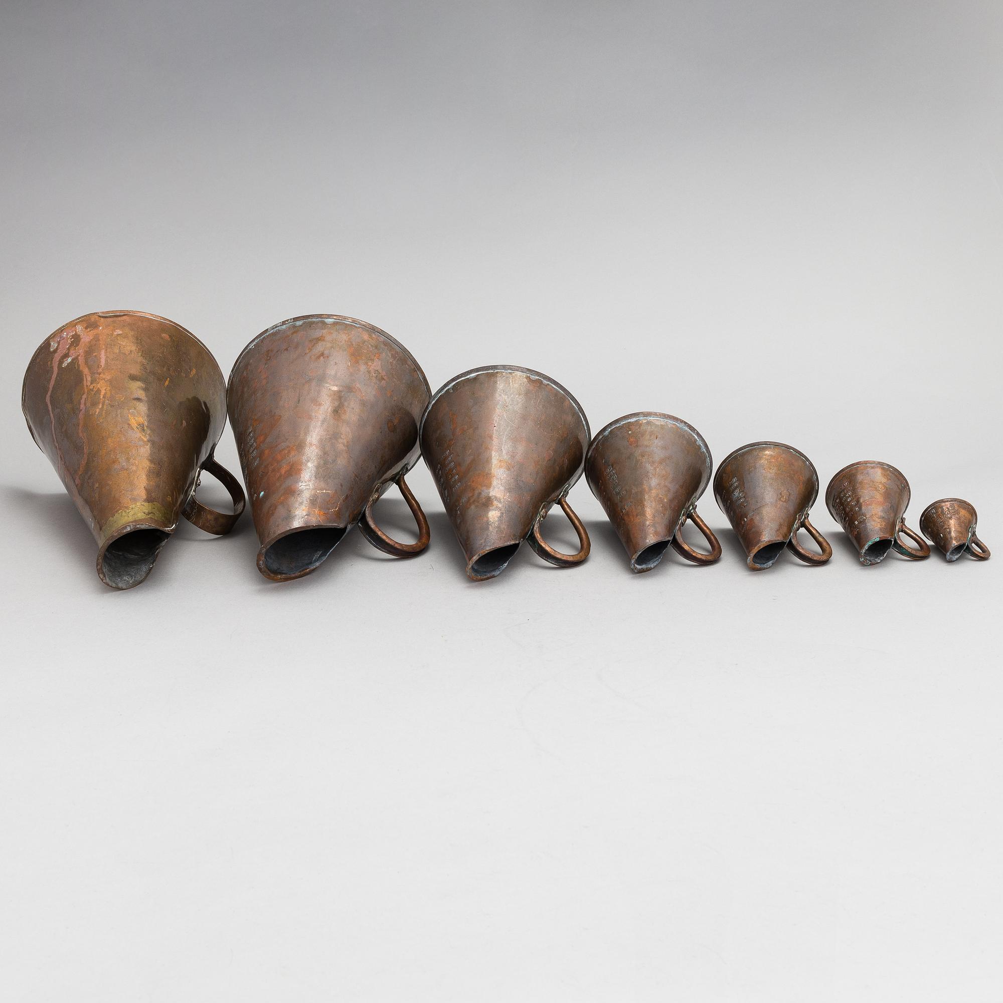 7 Swedish measuring cups from 20th century.