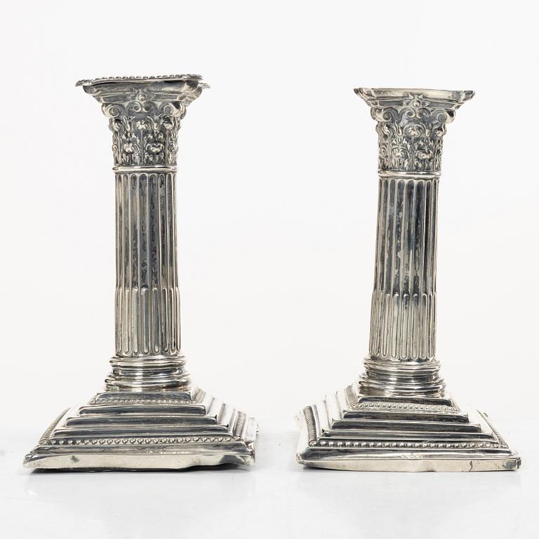 A pair of English silver column candlesticks, mark of Walter Latham & Son, Sheffield, 1910.