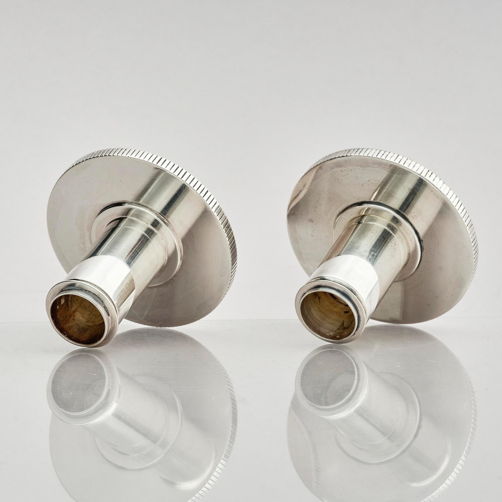 Georg Jensen, a pair of sterling silver candlesticks, design by Sigvard Bernadotte, model no 711A, Copenhagen, Denmark after 1945.