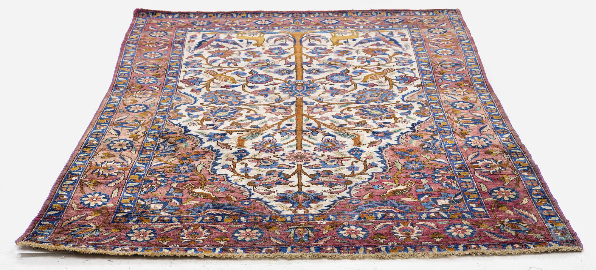 An Antique silk Keshan rug, Central Persia, c. 152 x 105 cm.