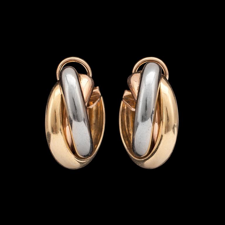 A pair of Cartier gold earrings.
