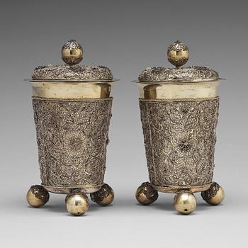 120. A pair of Swedish 17th century filigree and parcel-gilt silver beakers and covers, mark Rudolf Wittkopf, Stockholm 1698.