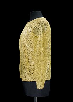 A 1990s golden blouse by Yves Saint Laurent.