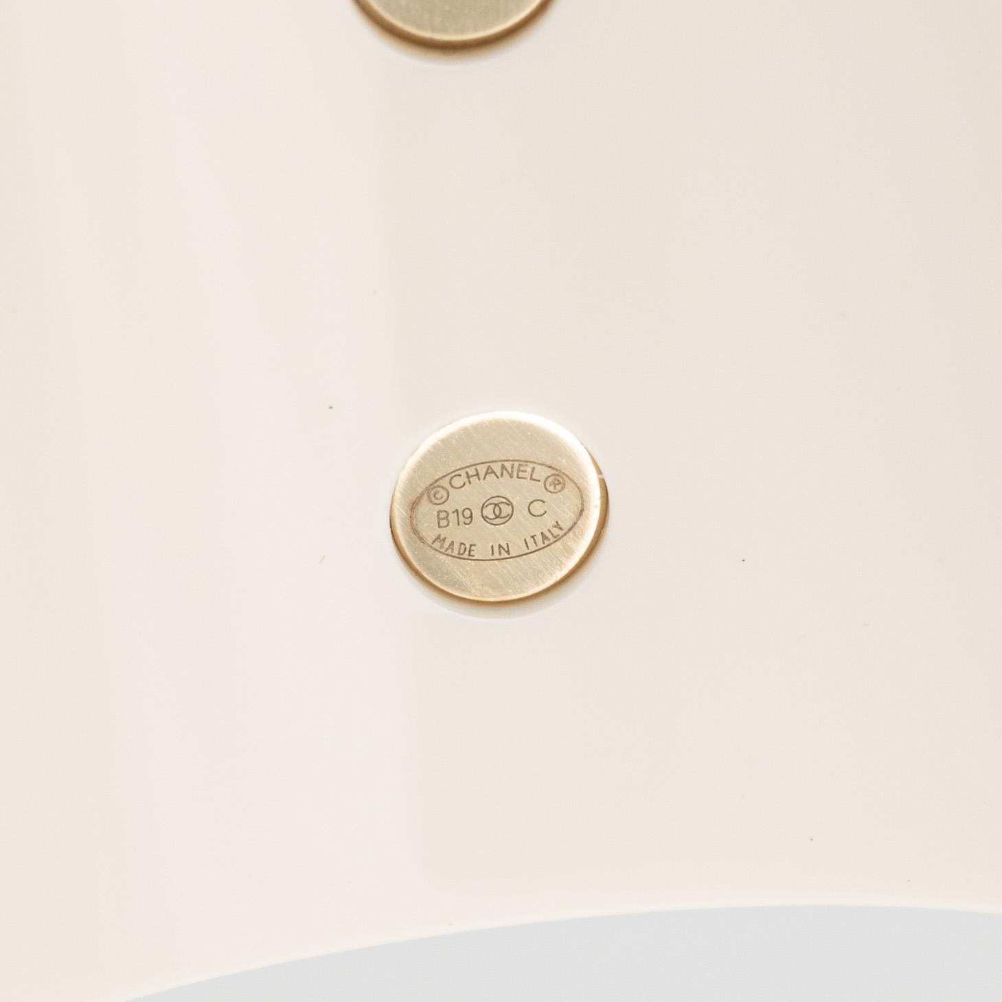 Chanel, a white acrylic bracelet with pearls, 2019.