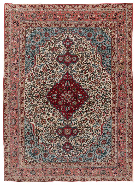 A semi-antique Qum carpet. Central Persia, c. 345 x 258 cm.