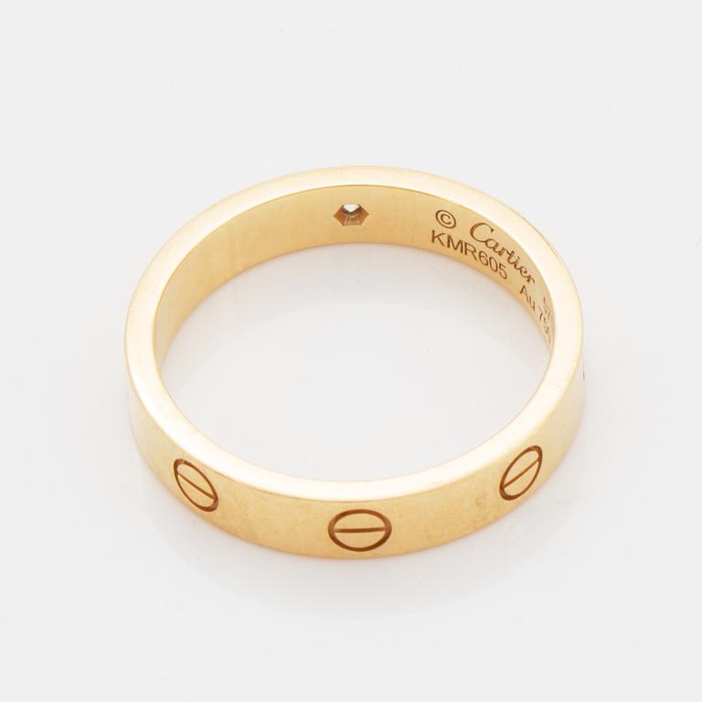Cartier ring "Love" 18K guld med en rund briljantslipad diamant.