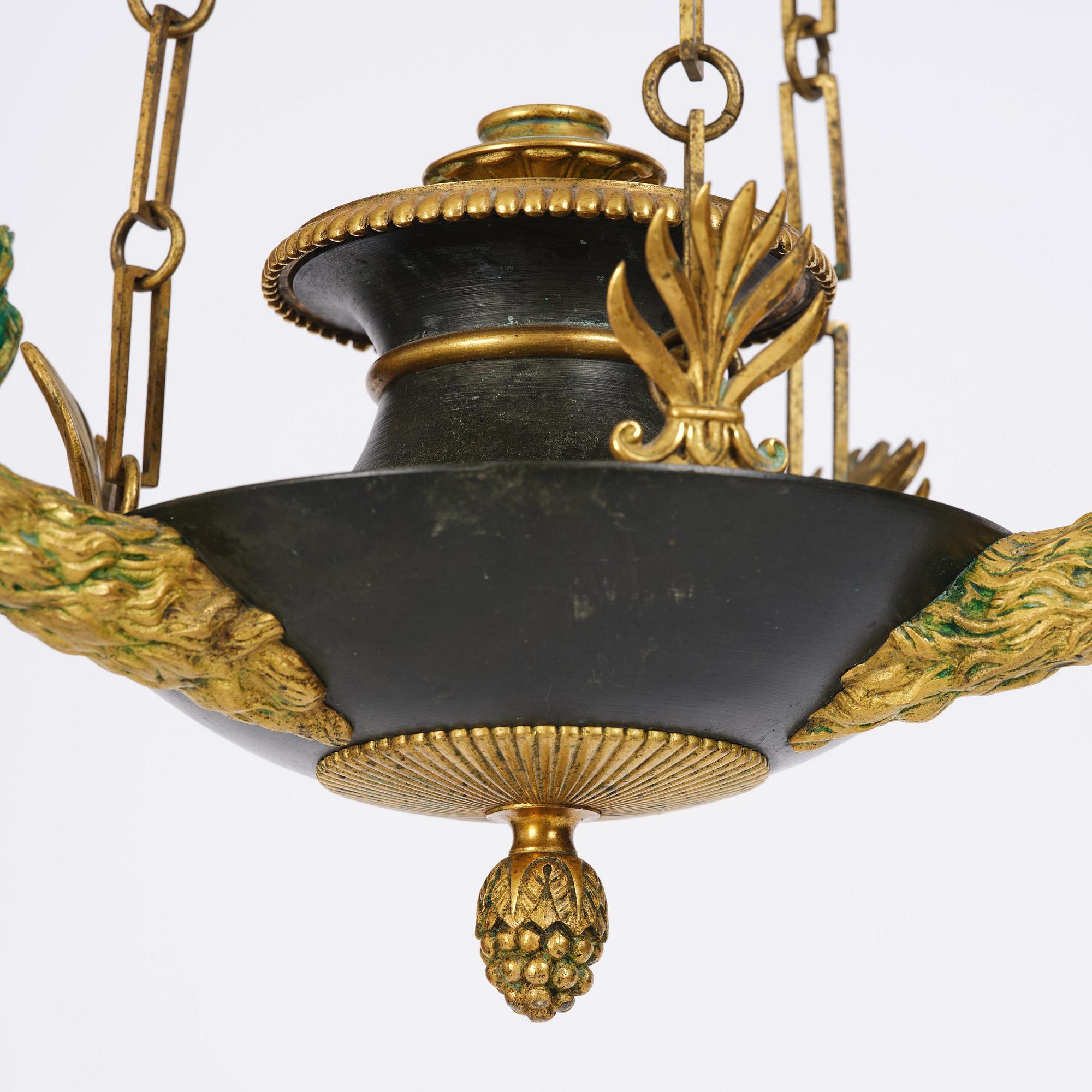An Empire ormolu and patinated bronze four-light chandelier, Stockholm, early 19th century.