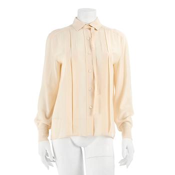 326. CÉLINE, a créme colored silk blouse.