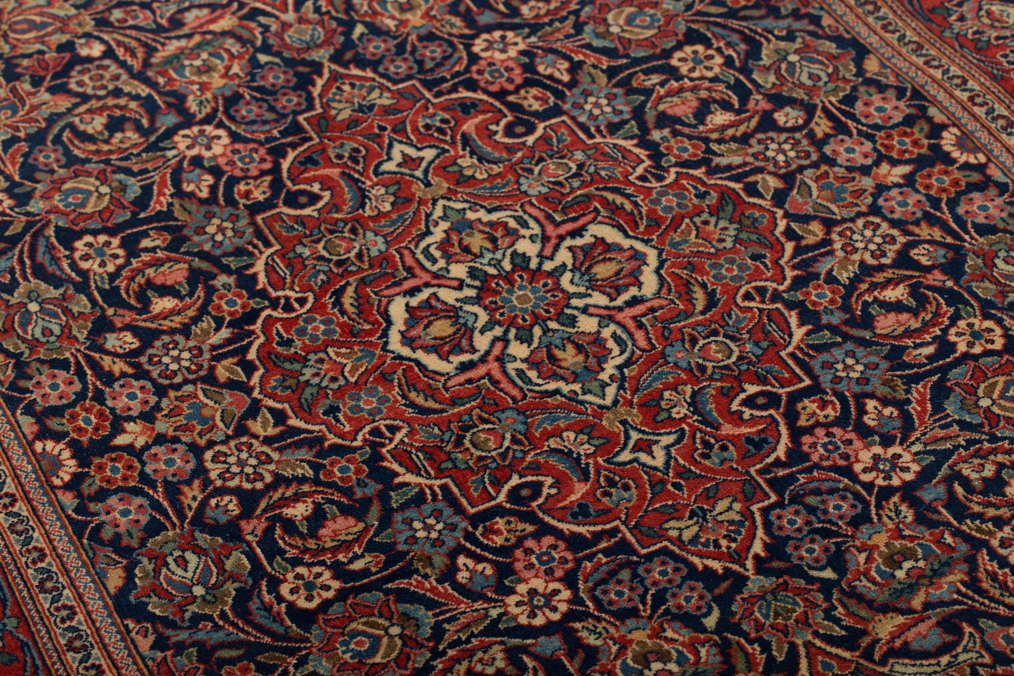 A RUG, a semi-antique Kashan, ca 210,5 x 132,5 cm.