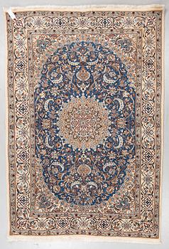 A carpet, Old Nain, part silk, ca 285 x 198 cm.