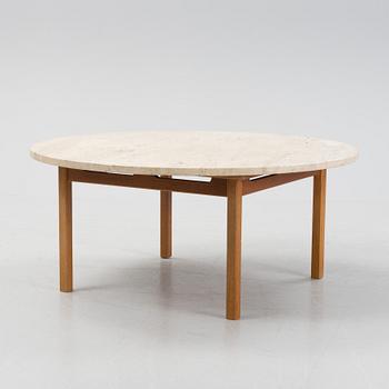 An oak coffee table with a later travertine top.