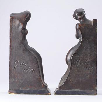 A pair of Axel Gute patinated bronze bookends, Sweden 1919.