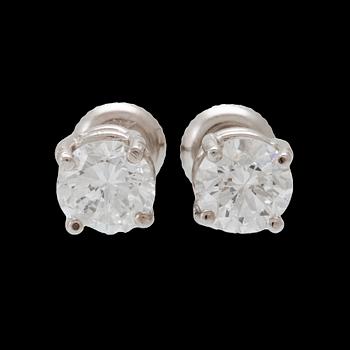 A pair of 14K white gold earrings set with round brilliant-cut diamonds.