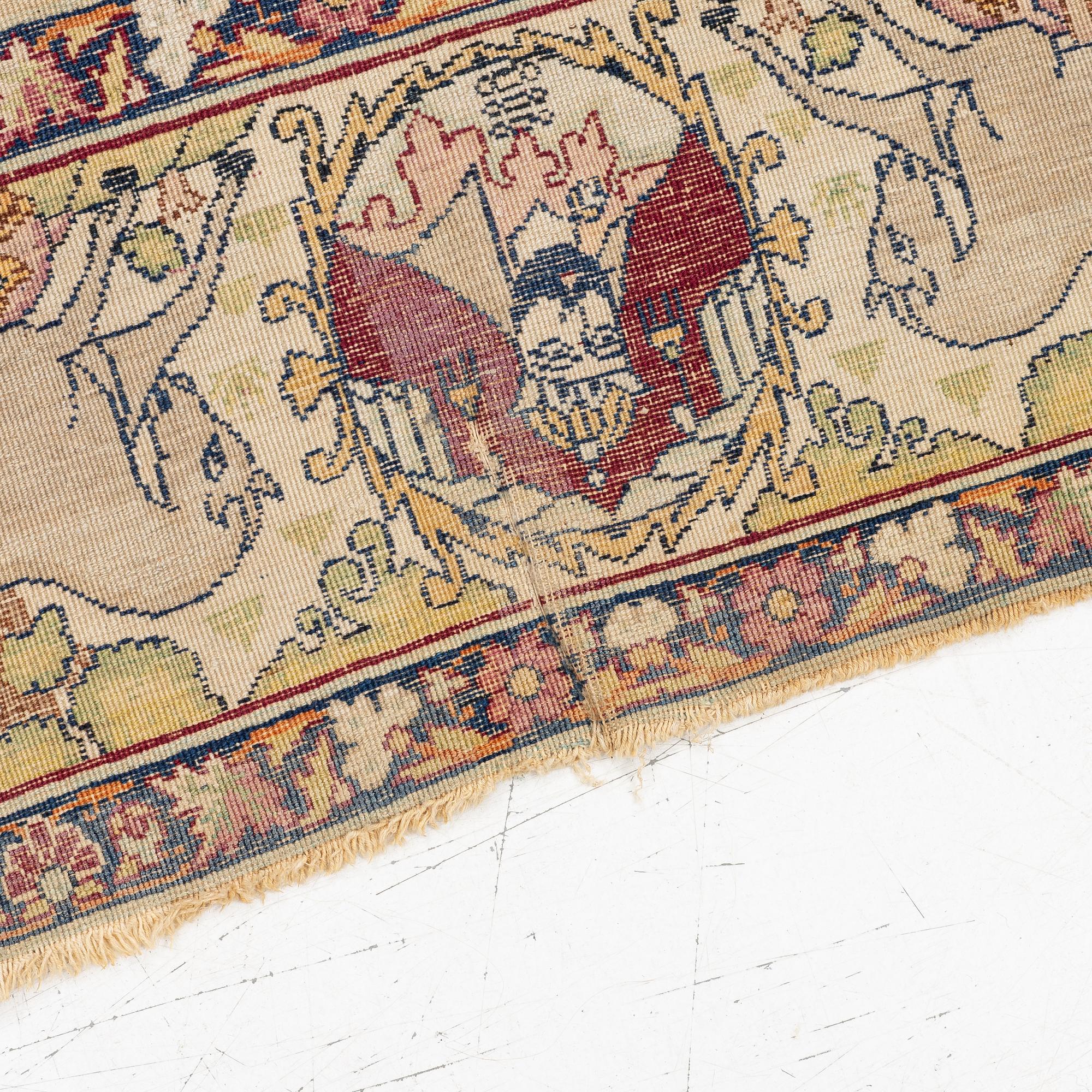 An antique Kerman Laver rug, South Persia, signed c.206 x 133 cm.