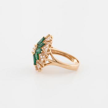 An marquise cut emerald and brilliant cut diamond ring.