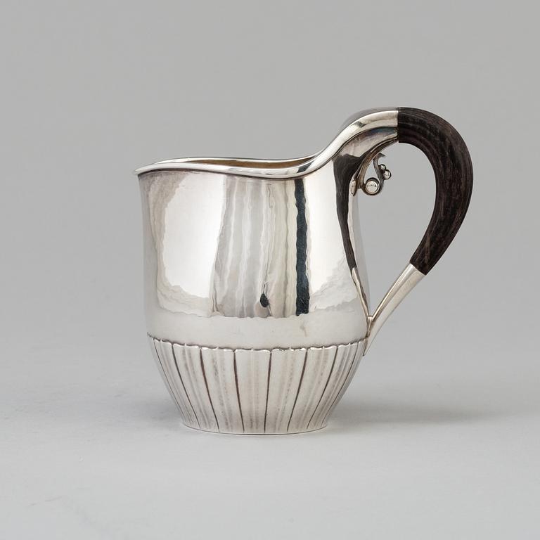 A"Cosmos", cream jug, sterling silver. Designed by Johan Rodhe for Georg Jensen, modell no 45E, weight 175 grams.