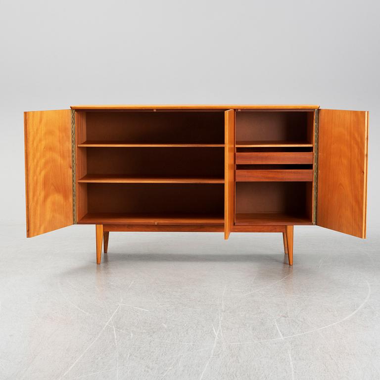 A mid 20th century teak veneered sideboard.