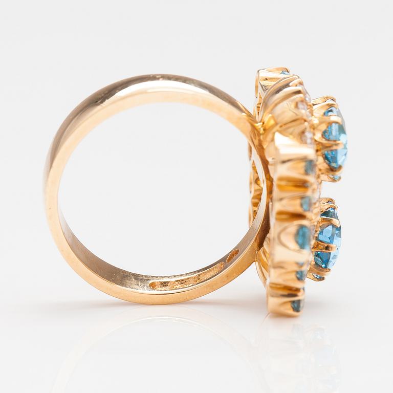 An 18K gold ring "Sophia Albertina" with diamonda ca. 0.54 ct in total and topazes. Ofelia Jewelry, Helsinki 1998.