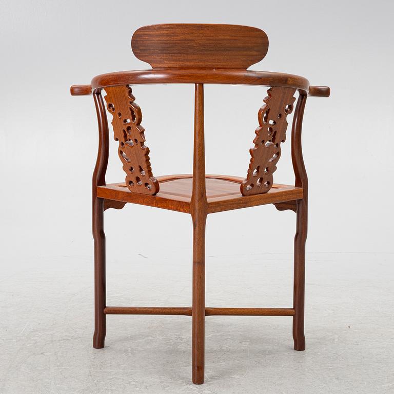 A Chinese hardwood corner armchair, 1900s.