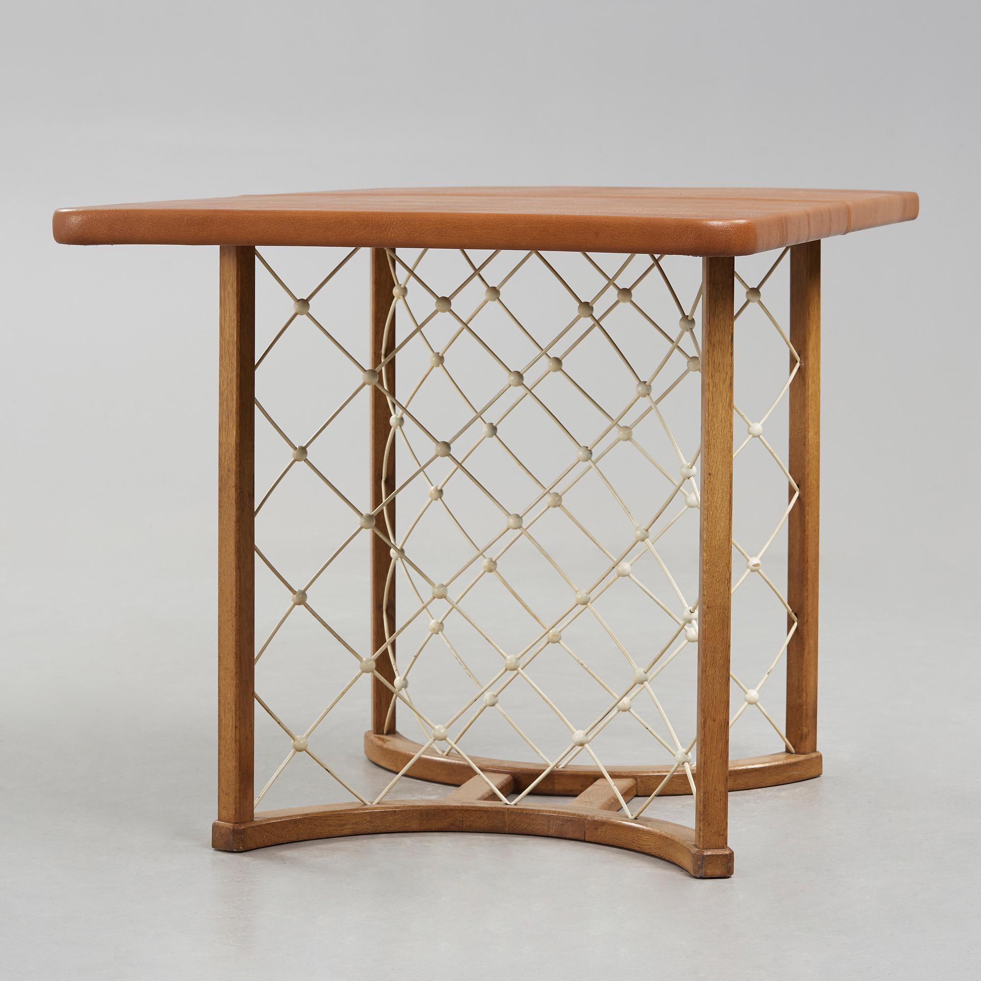 A modernist oak based table, 1940-50's.