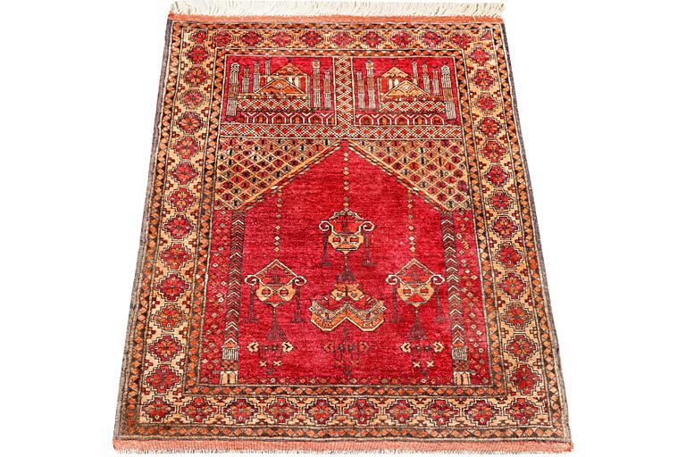 A silk Beluch rug, c. 124 x 81 cm.