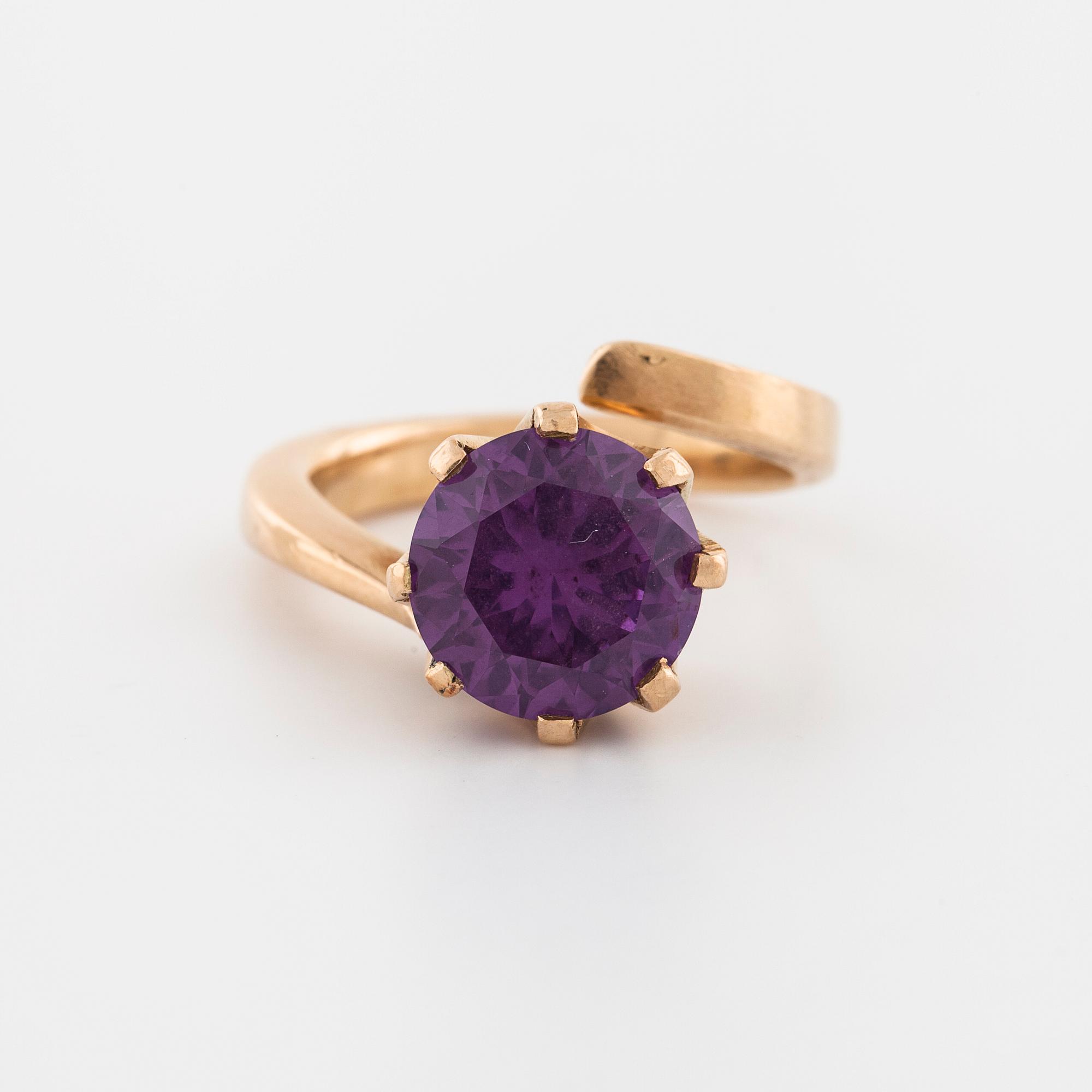 A synthetic color change sapphire ring.