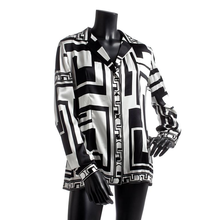 EMILIO PUCCI, a silk shirt with belt.