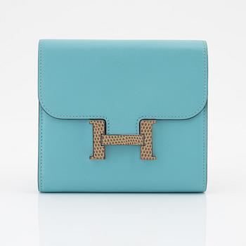 Hermès, a blue leather 'Constance' wallet.