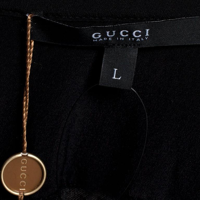 GUCCI, a black cashmere and silk tuxedo shirt.
