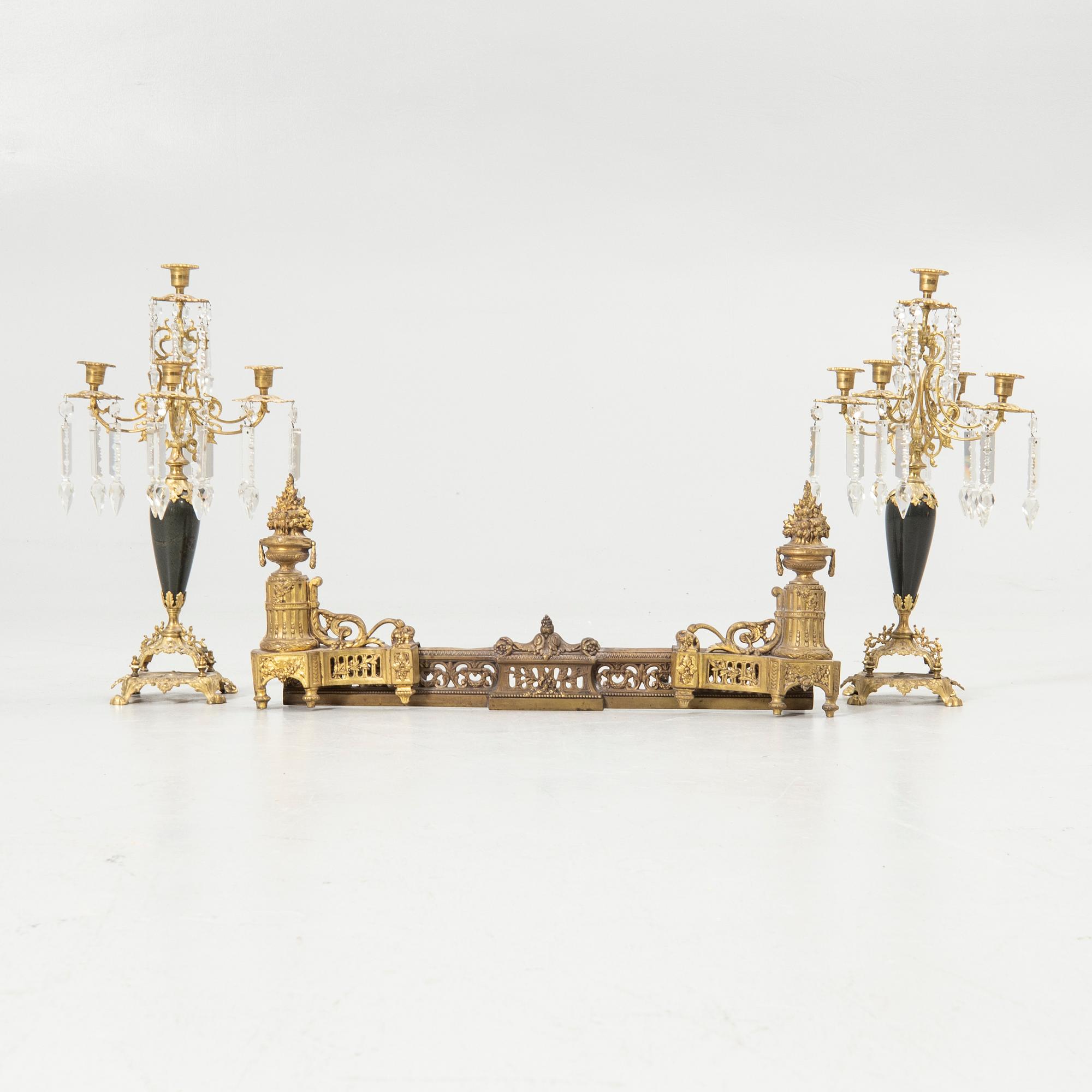 Pair of candelabra and a firedog, 18th/19th century.