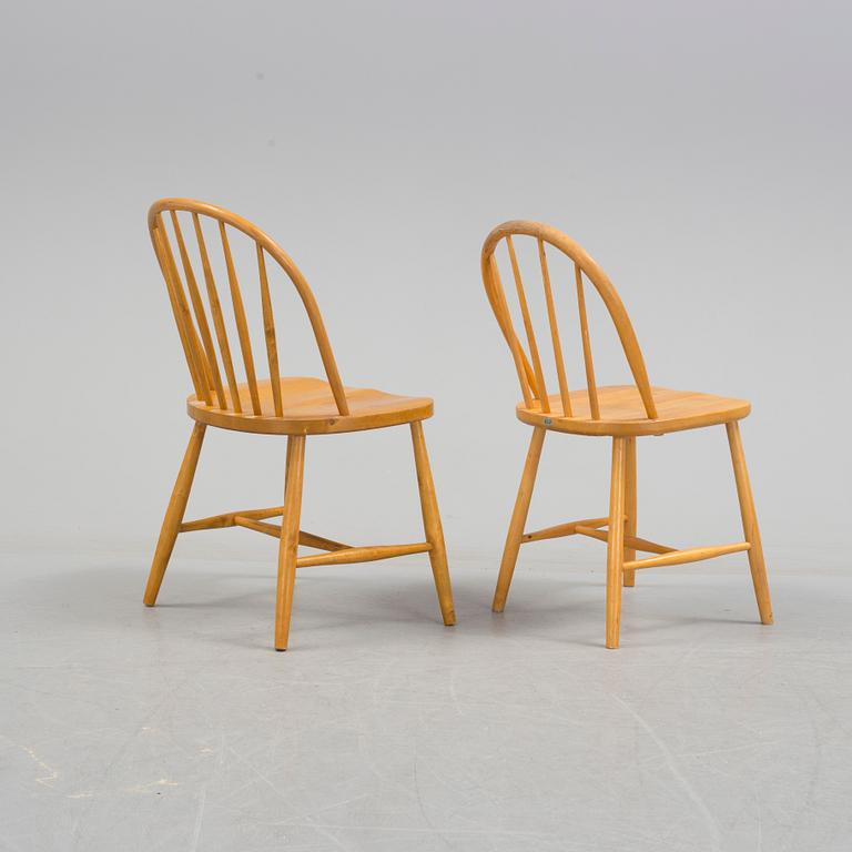 Seven matched mid 20th Century birch and beech chairs.