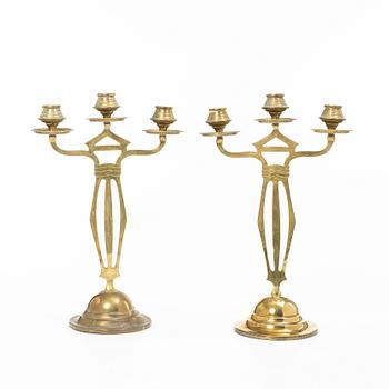 Jugend/Art Nouveau, A pair of brass candelabra, early 20th century.