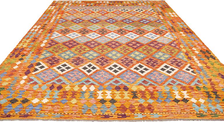 A kilim carpet, approximately 351 x 254 cm.