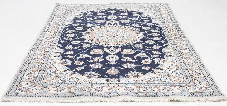 A Nain carpet, c. 255 x 150 cm.