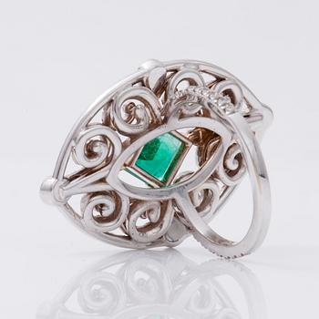 An octagonal/step-cut emerald, 1.65 cts, and diamond 1.25 cts (pavé-set) ring.