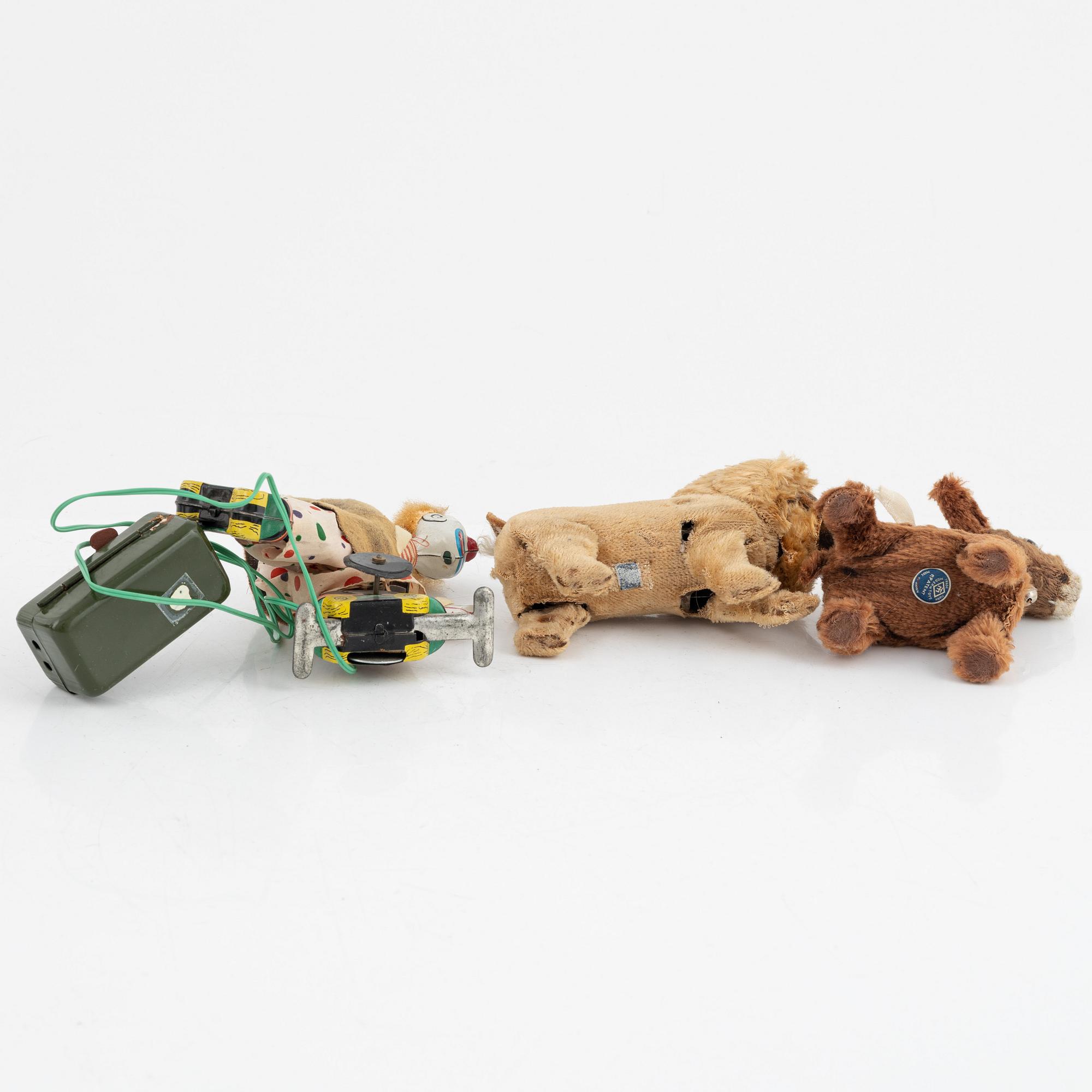 A set of five toys, including 'Rolly' clown from Schuco, 20th century.