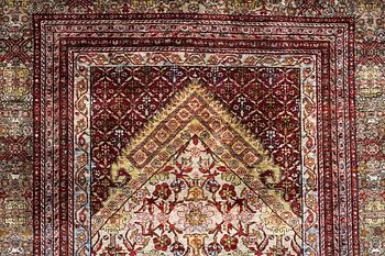 A semi-antique silk Qum rug, central Persia 221 x 138 cm.