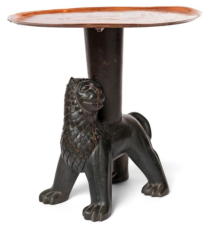 An Anna Petrus table, Sweden early 1920's. Sculptured oak with an engraved copper tray.