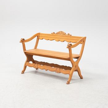 A carved oak sofa, circa 1900.