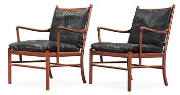 A pair of Ole Wanscher palisander and black leather 'Colonial Chairs, PJ 149', Poul Jeppesen, Denmark.