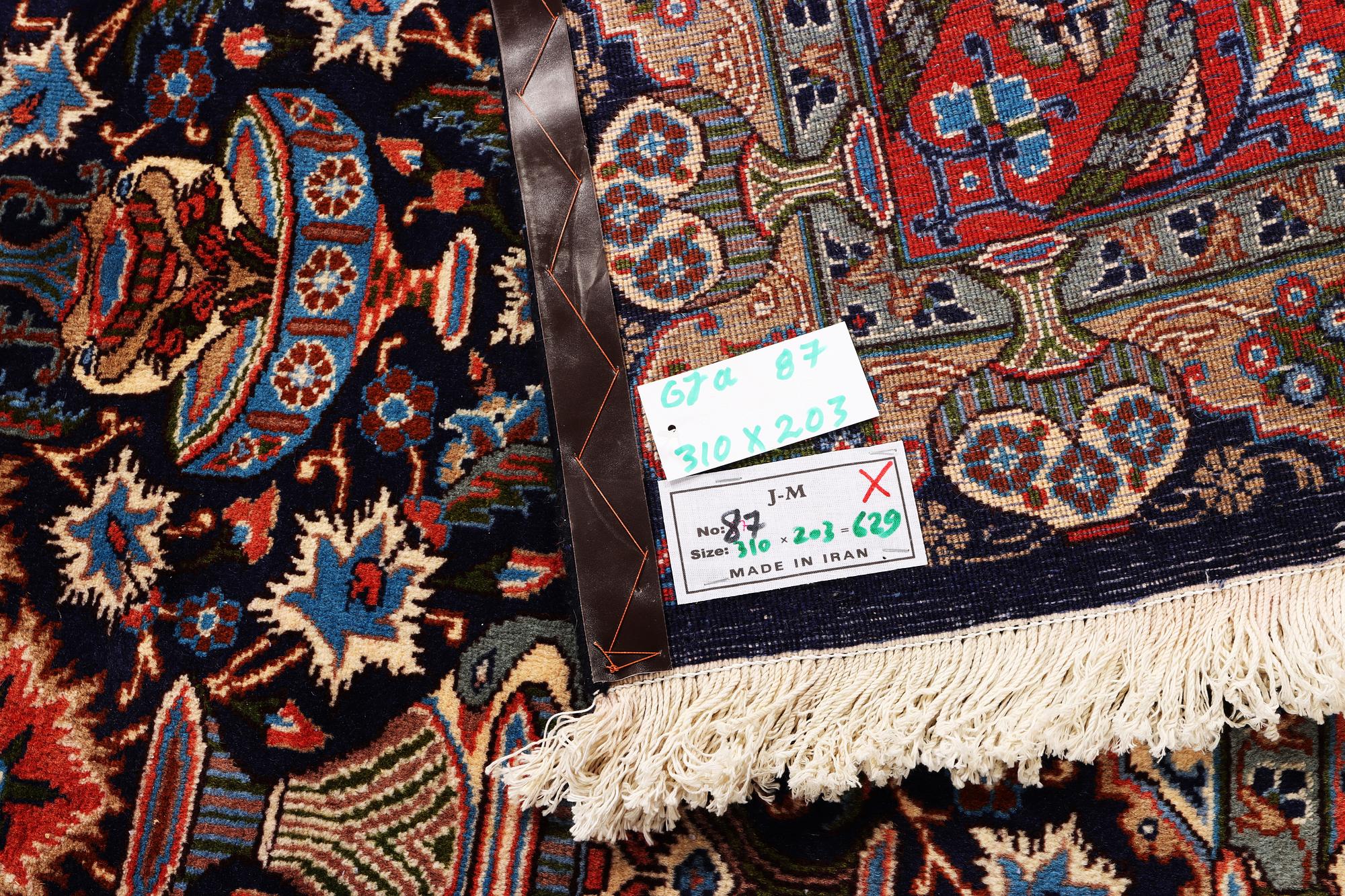 A Kashmar carpet, c. 310 x 203 cm.