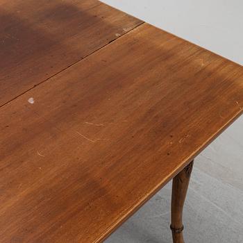 An English mahogany table, 19th Century.