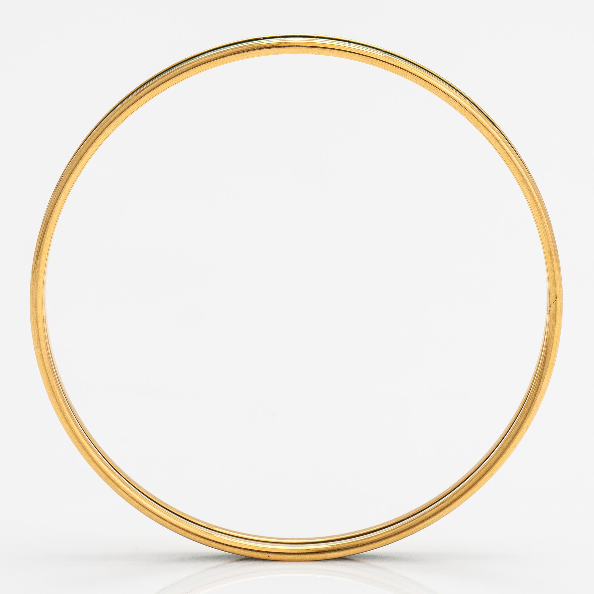 Hermès, a bracelet made of gold coloured metal and green enamel. Marked Hermès Paris, Made in France.