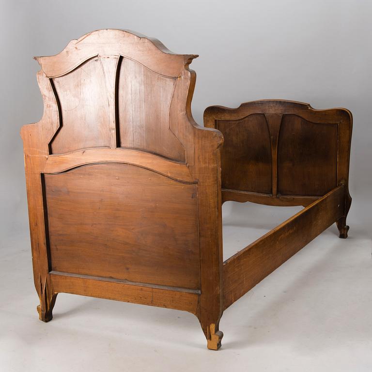 A pair of early 20th Century art nouveau style beds.