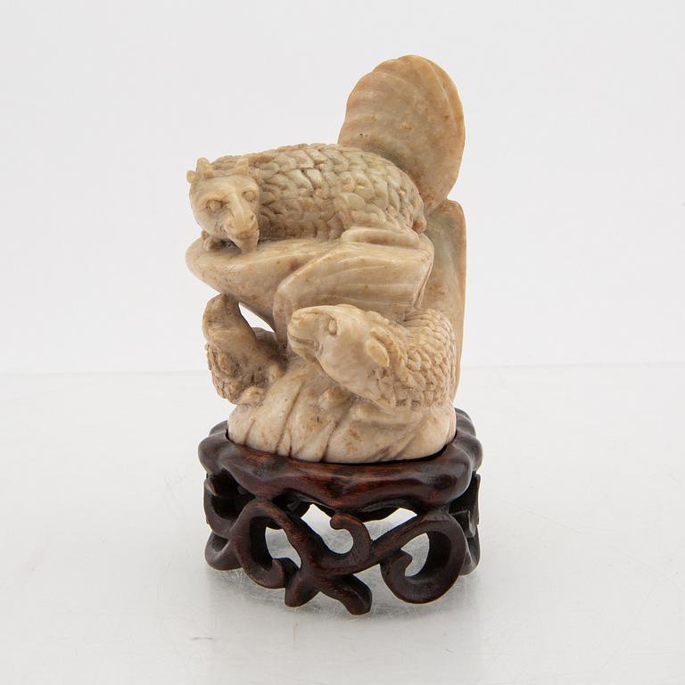 A Chinese stone sculpture 20th century.