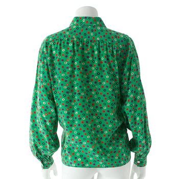 YVES SAINT LAURENT, a green silk blouse.