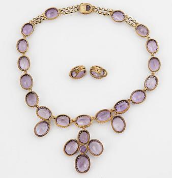 A necklace and a pair of earrings in silver set with amethysts.