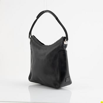 Gucci, a black leather bag.