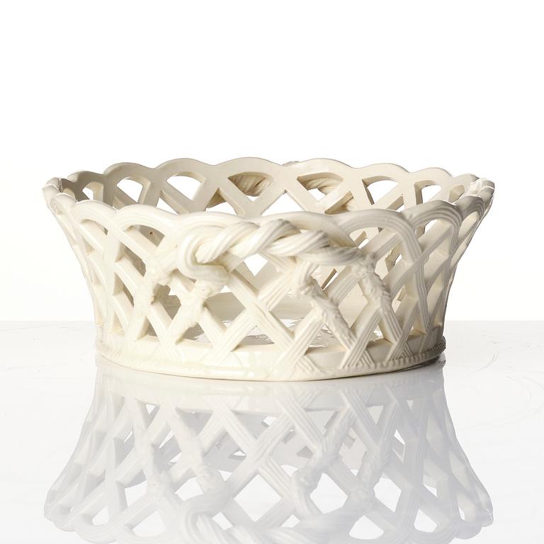 A latticed creamware chestnut basket with stand, 19th century.