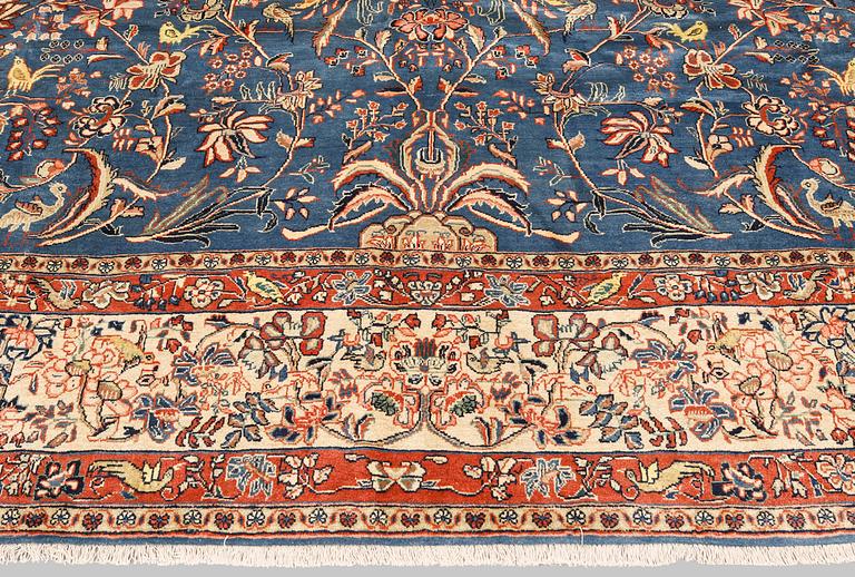 A figural Sarouk carpet, approx. 412 x 300 cm.